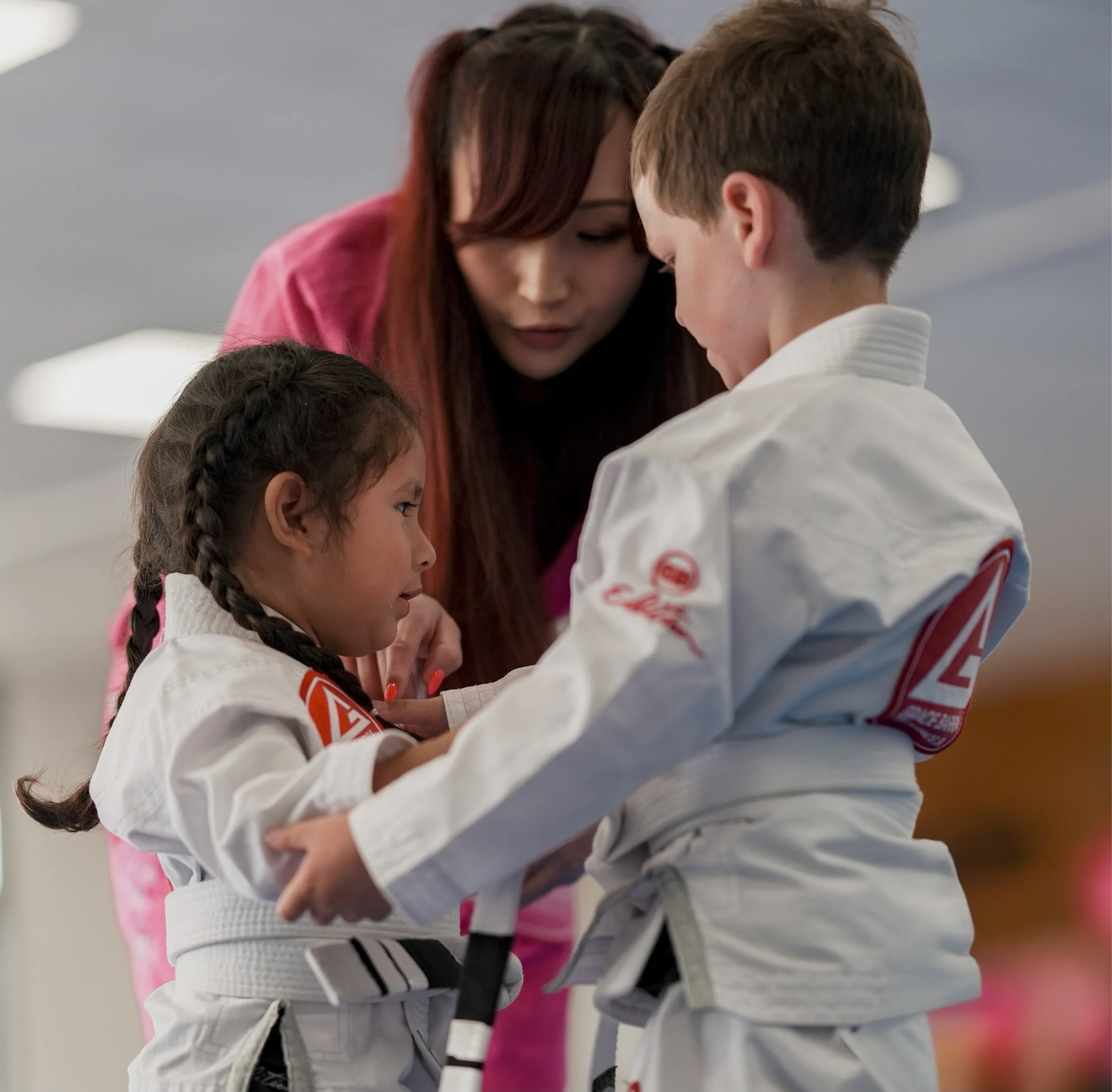 Kids and families training Brazilian Jiu-Jitsu at Gracie Barra San Marcos academy in North County San Diego