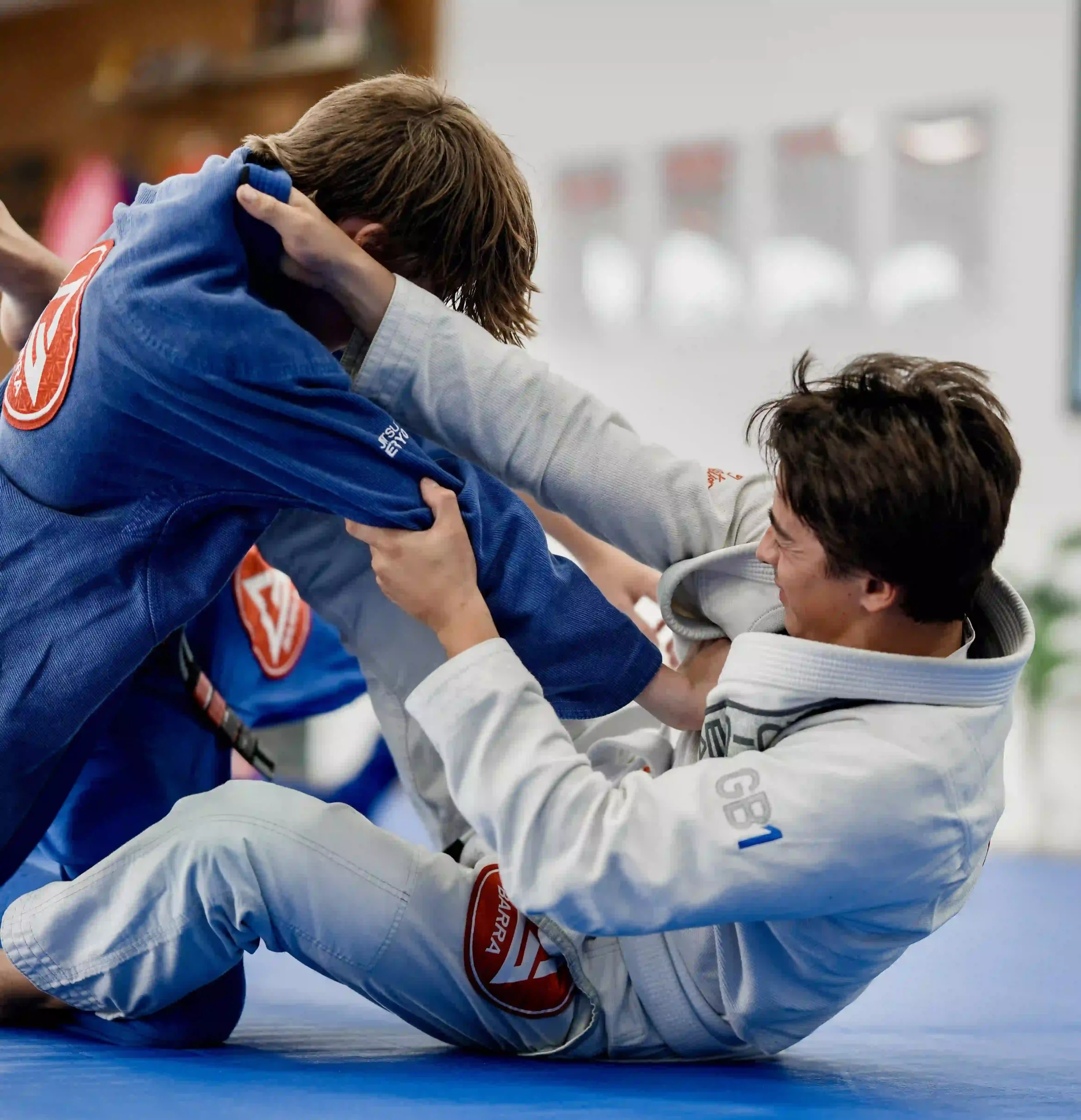 Adult students learning BJJ self-defense techniques in an All Levels class in San Marcos CA