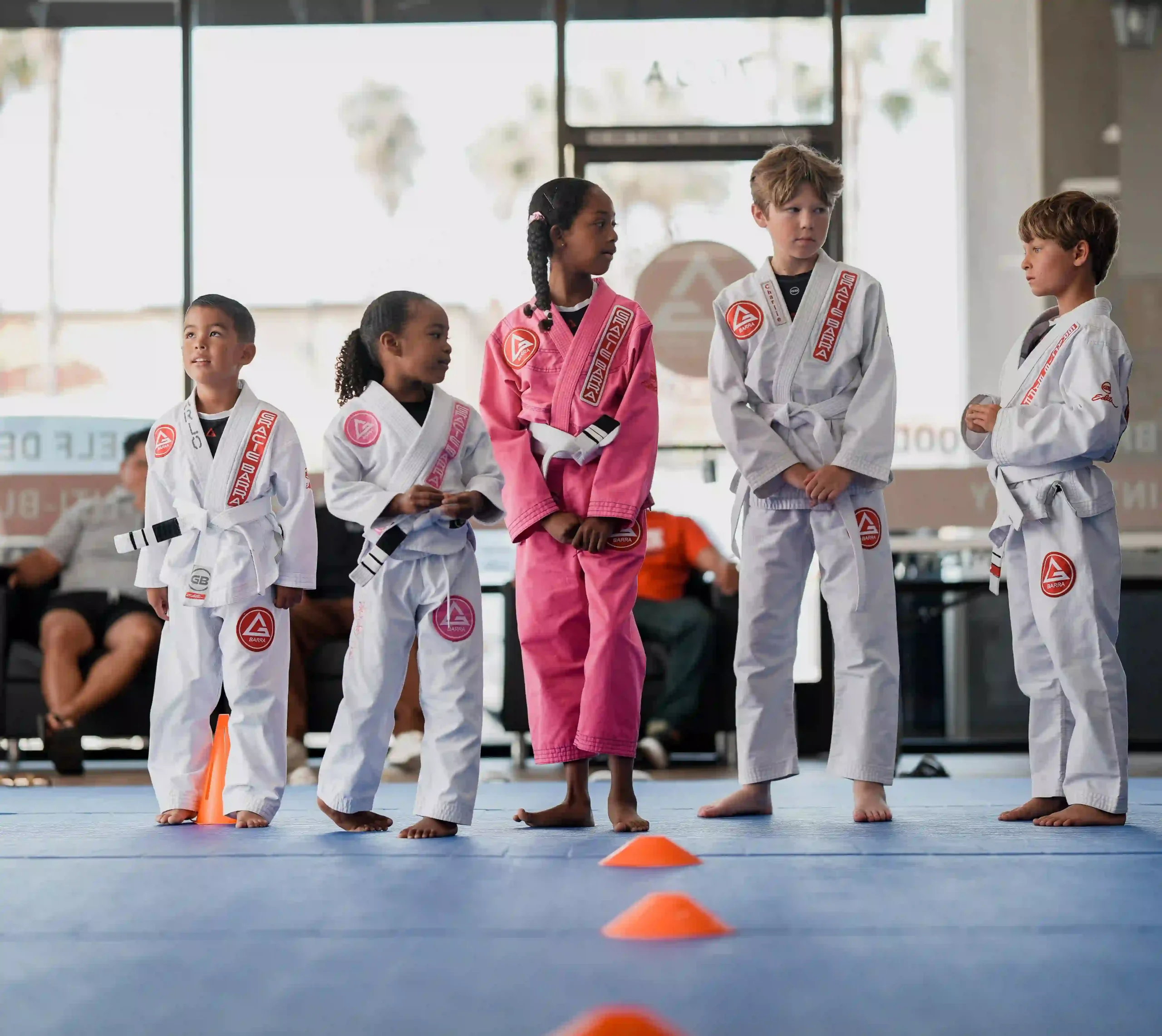 Kids BJJ Classes - Building Confidence Young kids practicing Jiu-Jitsu movements and building confidence on the mats in San Marcos