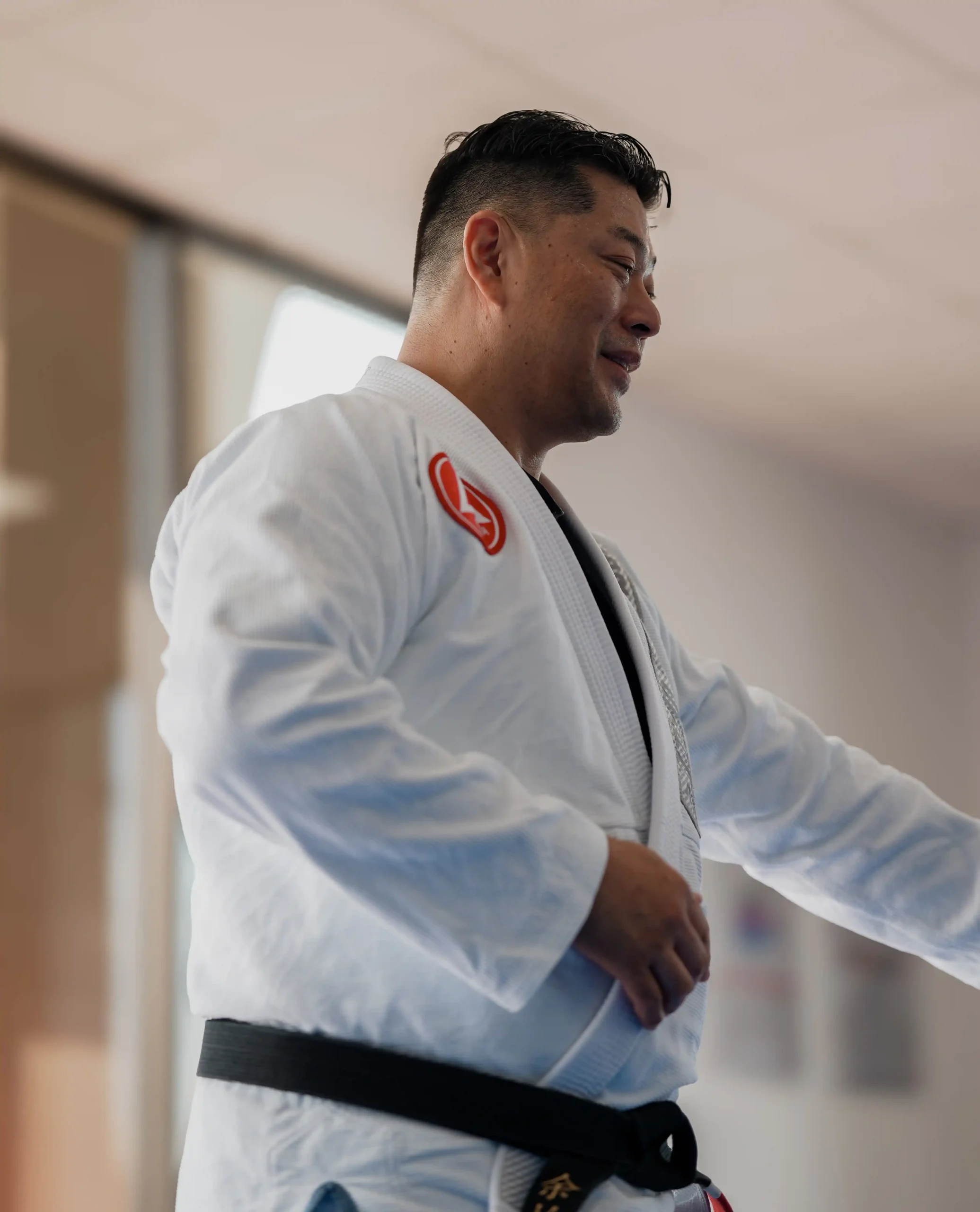 Professor Michael Yu, BJJ black belt and head instructor teaching martial arts at Gracie Barra San Marcos